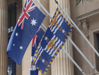 The flags of Australia, Queensland, and Brisbane adorn the city hall there.